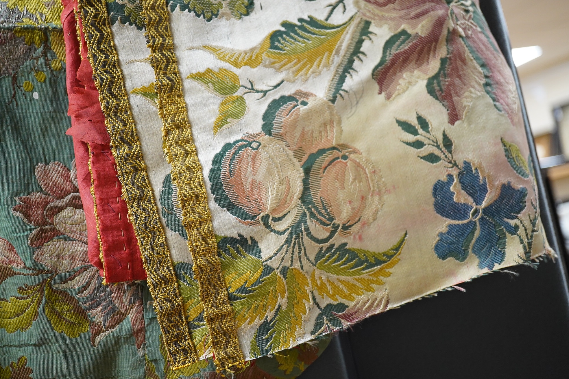 Samples of 18th century French, possibly Lyon silk, short loom brocades including two pairs and three single samples of varying sizes, one pair multi polychrome of large exotic flowers and fruits, the other pair pale blu